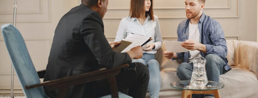 Image of a couple discussing their divorce with a lawyer